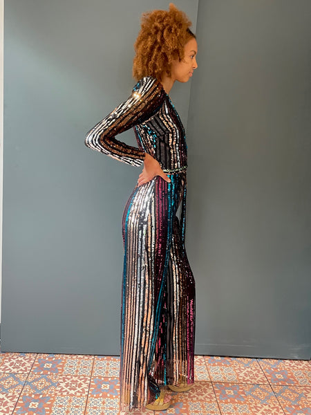 Elegant woman's jumpsuit in rainbow sequin - full side view