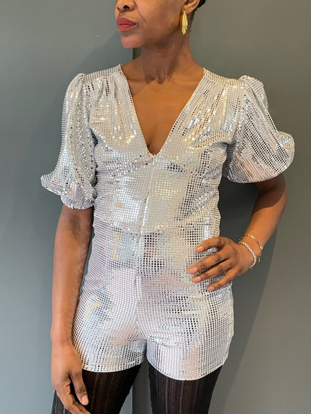 Close up of the silver disco playsuit