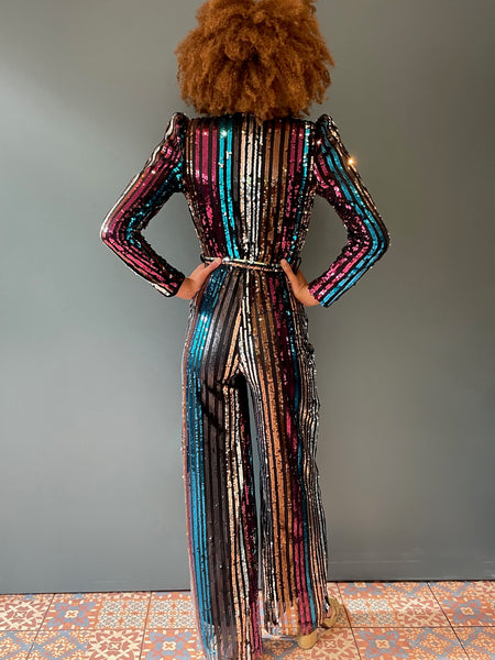 Elegant woman's jumpsuit in rainbow sequin - full rear view