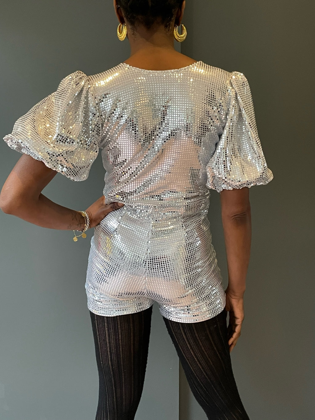 Back view of our sparkling silver disco playsuit