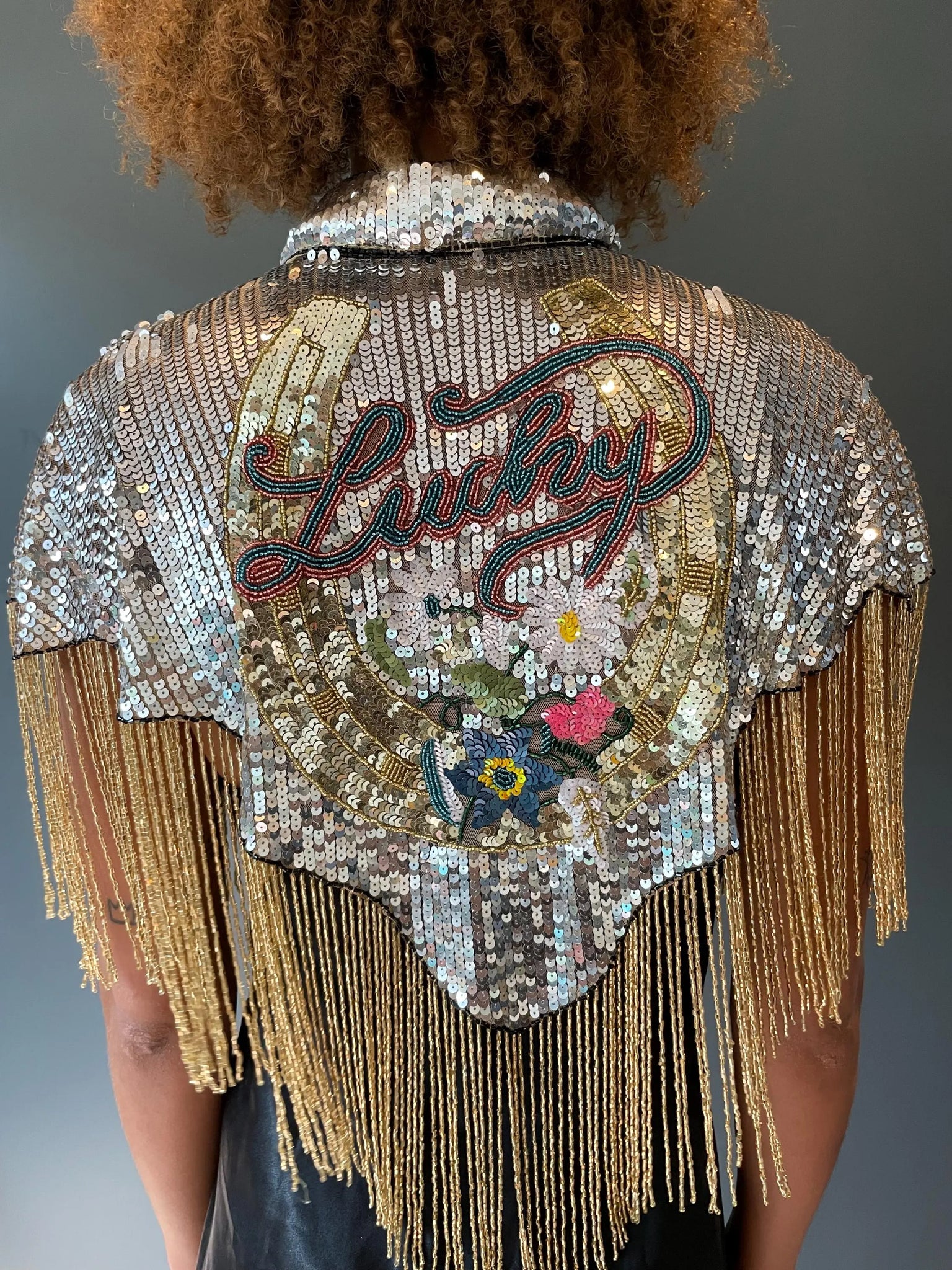 Lucky Silver and Gold sequinned cape with horseshoe detail